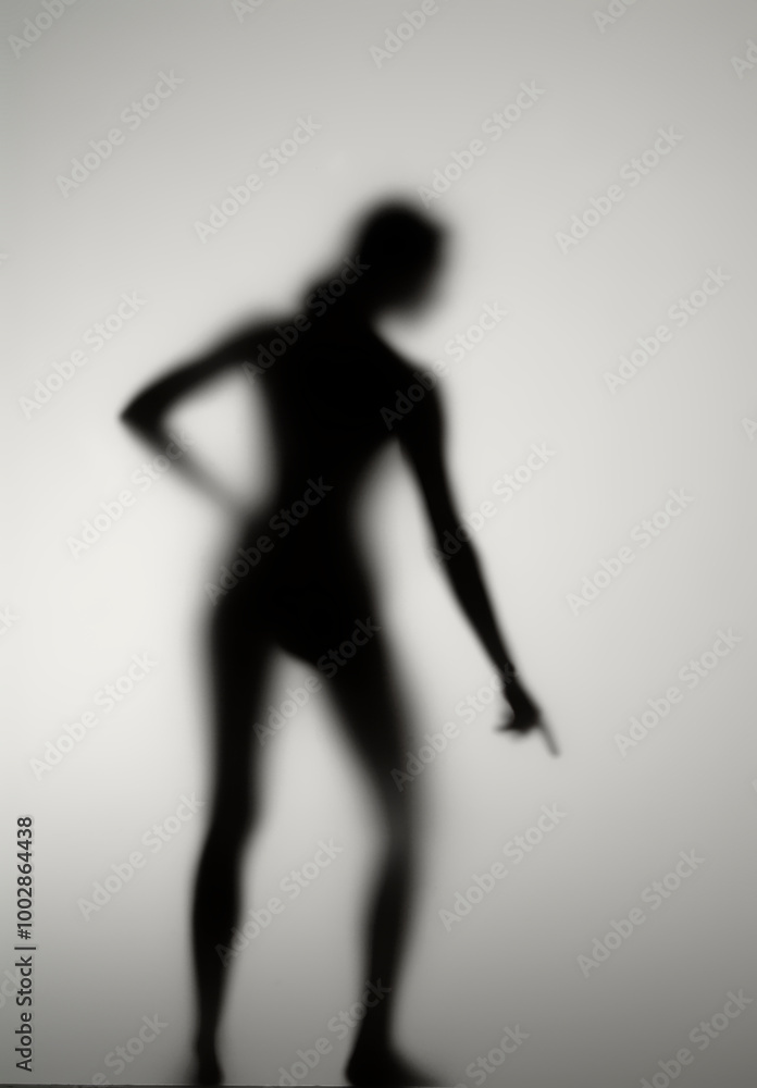Silhouette of a girl behind opaline glass
