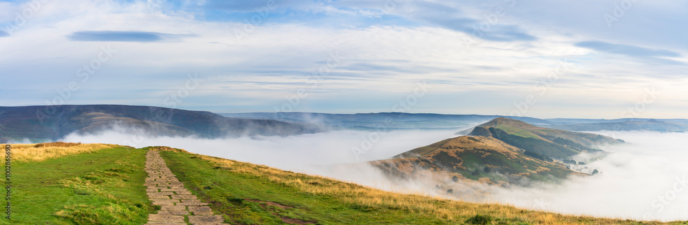 Mam Tor in Peak District with clouds surrounding Back Tor and Loose Hill peaks. United Kingdom. England Mam Tor in Peak District with clouds surrounding Back Tor and Loose Hill peaks. United Kingdom. England