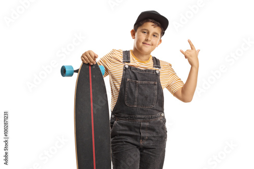 Cool boy posing with a longboard and gesturing a rock and roll sign photo