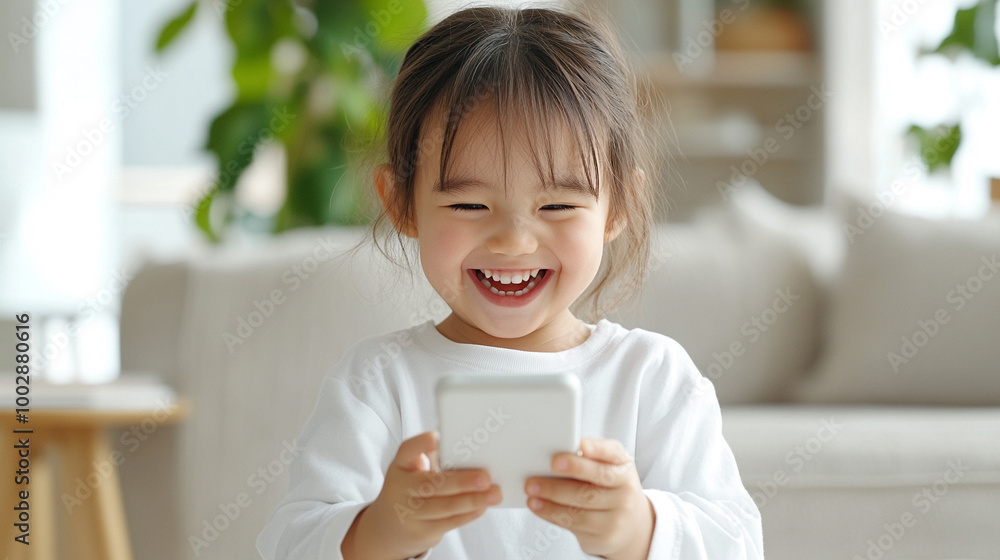 A cute child wearing white is happily playing with her mother's smartphone.
A cute child wearing white is happily playing with her mother's smartphone.