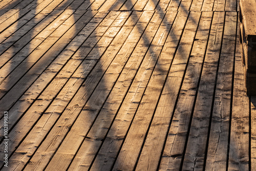 Shadows on the pier in Scheveningen during sunset. Natural light, travel destinations, tourism, Netherlands.