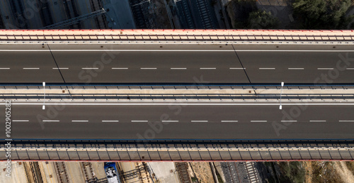 Fototapeta Aerial zenithal view of a bridge with an empty highway