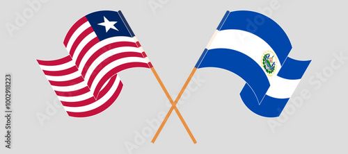 Crossed and waving flags of Liberia and Republic of El Salvador. Vector illustration