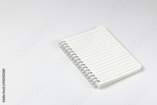 Ring-bound notebook or appointment book isolated on white background. Stationery item.