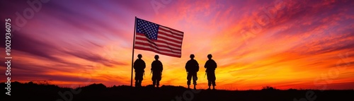 Silhouetted soldiers stand proudly beneath a vibrant sunset, holding the American flag, symbolizing freedom and bravery.