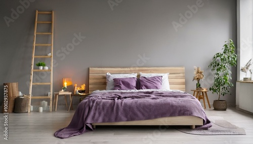 A minimalist Scandinavian bedroom with a light wooden bed dressed in deep purple bedding, a