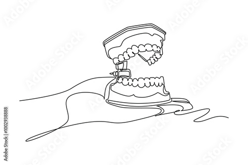 Single one line drawing of doctor or dentist hand holding anatomical complete adult human teeth set. Medical internal anatomy education concept. Continuous line draw design graphic vector illustration
