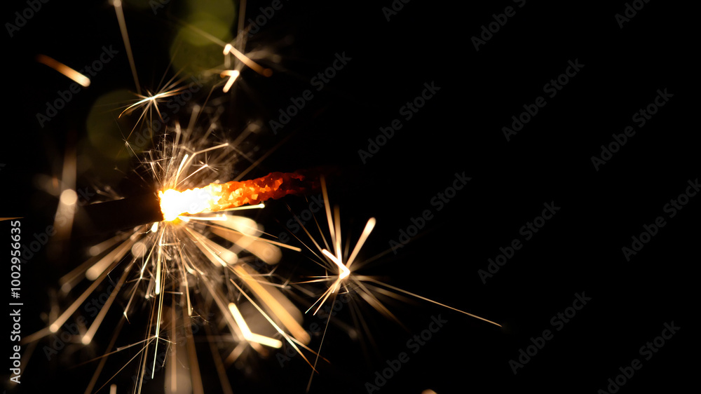 Bengal fire on blurred background with bokeh, new year and Christmas holidays, banner Bengal fire on blurred background with bokeh, new year and Christmas holidays, banner