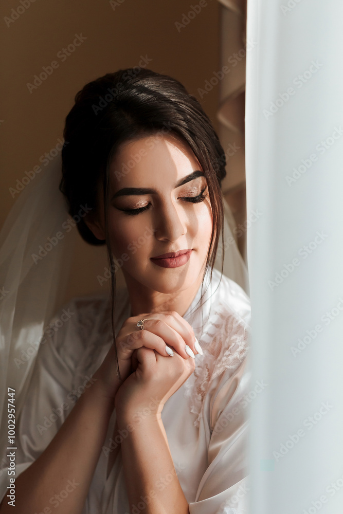 A woman is wearing a white dress and a veil. She is looking at the camera with a smile on her face A woman is wearing a white dress and a veil. She is looking at the camera with a smile on her face
