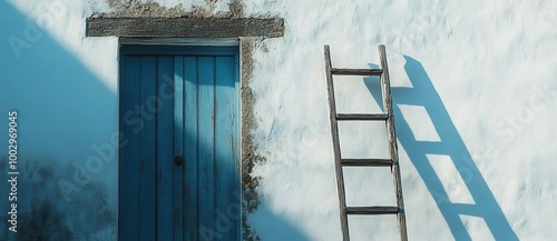 Blue door on old white building in Greece with wooden ladder, traditional architecture