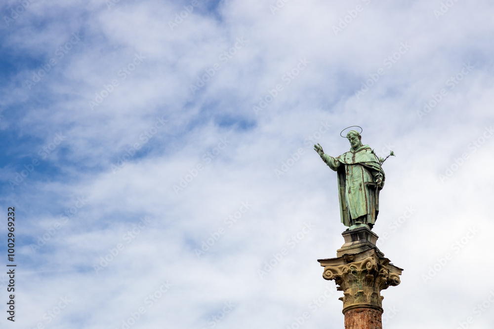 View of statue and column of San Domenico (Saint Dominic) at San Domenico Square in Bologna, Italy