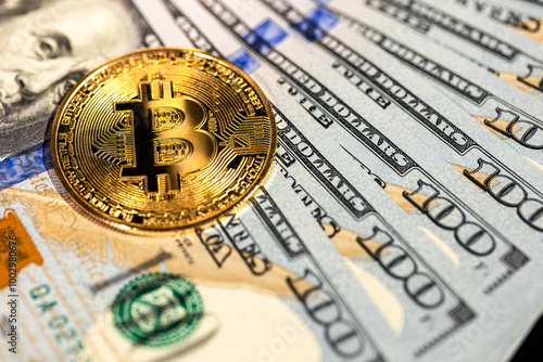 Bitcoin coin with 100 dollar bill. Concept of finance background close-up.