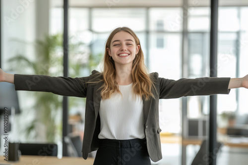 Free Download Confident Successful Young Caucasian Business Woman Arms Spread in Modern Office Environment, Showcasing Corporate and Professional Lifestyle - GFXLoad