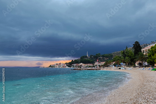 Cloudy day on the beach in Podgora, the Adriatic Sea in Croatia photo