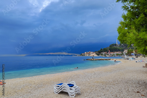 Cloudy day on the beach in Podgora, the Adriatic Sea in Croatia photo