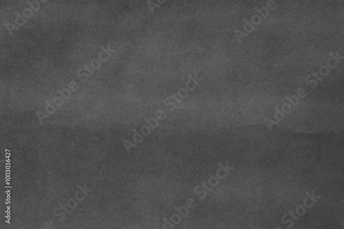 Black grains paper texture macro closeup