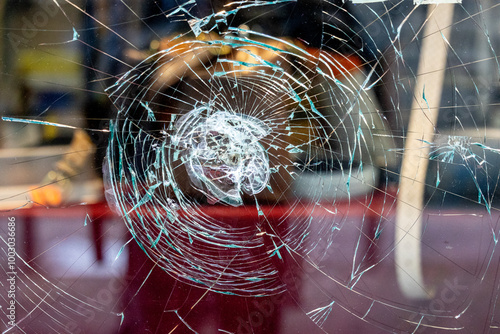 Traces of Vandalism: Shattered Shop Window in a Remote Street, Attempted Robbery photo