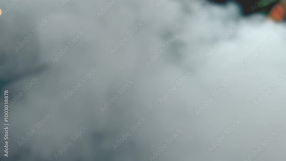 Thick Steam Clouds of Smoke Rising from Trash: Blurry Motion of Icy White Plumes Thick Steam Clouds of Smoke Rising from Trash: Blurry Motion of Icy White Plumes