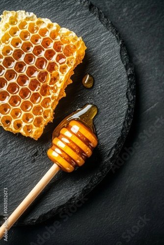 Honeycomb and drizzled honey on a dark slate plate showcasing natural sweetne...