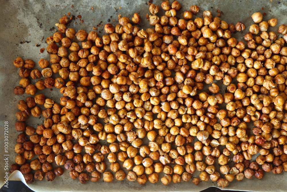 Sheet pan with homemade roasted chickpeas. Top view. Sheet pan with homemade roasted chickpeas. Top view.