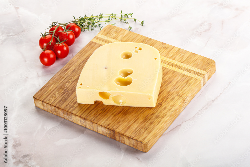 Maasdam cheese brick over board Maasdam cheese brick over board