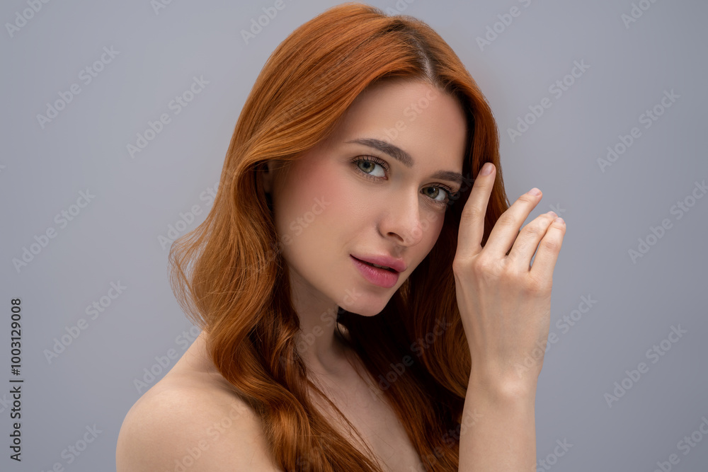 Pretty ginger long-haired young woman looking relaxed Pretty ginger long-haired young woman looking relaxed