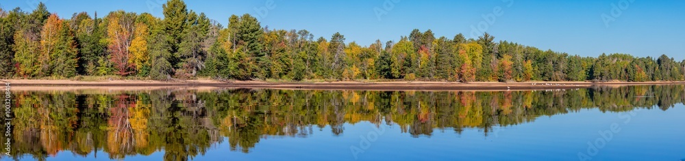 Colorful trees on Lake Nokomis, Tomahawk Wisconsin at the end of Septmber Colorful trees on Lake Nokomis, Tomahawk Wisconsin at the end of Septmber