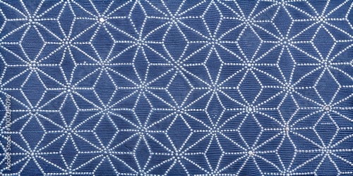 Intricate blue fabric with white geometric star patterns 