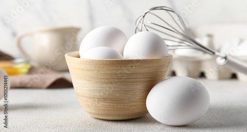 Bowl with raw chicken eggs ...