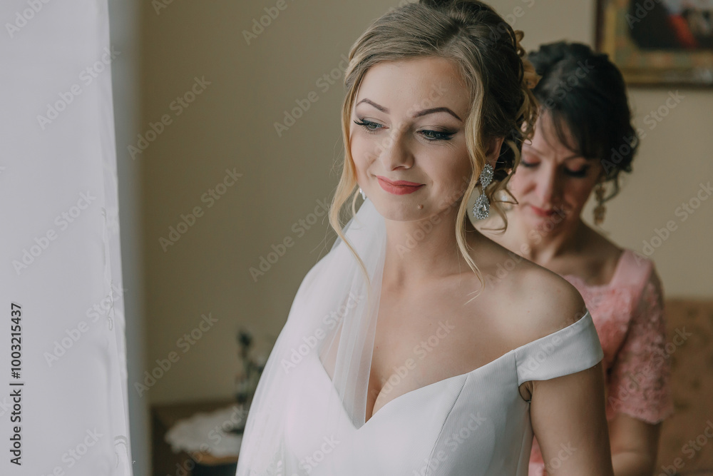 A bride is getting ready for her wedding, with her mother helping her. The bride is wearing a white dress and a veil, and her mother is adjusting her hair. The scene is filled with love and support A bride is getting ready for her wedding, with her mother helping her. The bride is wearing a white dress and a veil, and her mother is adjusting her hair. The scene is filled with love and support