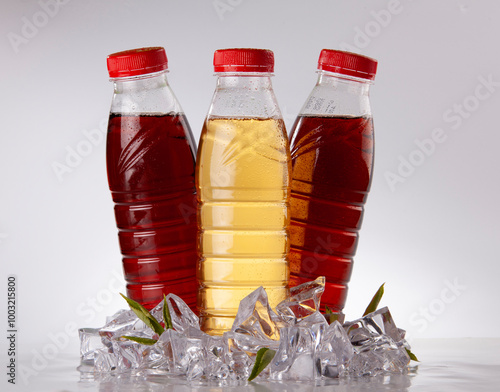 Three Bottles of Refreshing Iced Tea on White Background