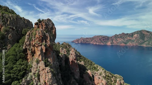 Explore the stunning cliffs and blue waters of Corsicas breathtaking coastline in summer photo