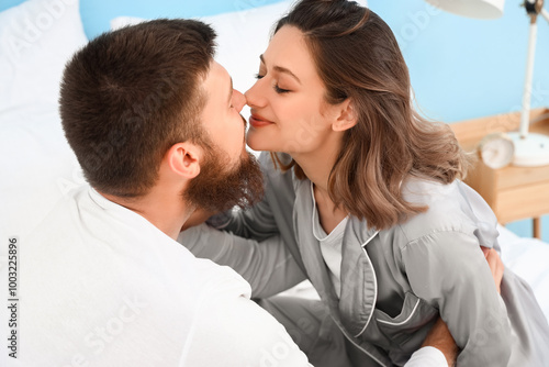 Happy couple in love in bed...