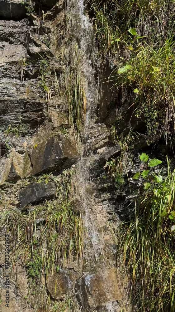 Flowing Down a Mountain Wall in 4K – Nature's Power and Beauty Flowing Down a Mountain Wall in 4K – Nature's Power and Beauty