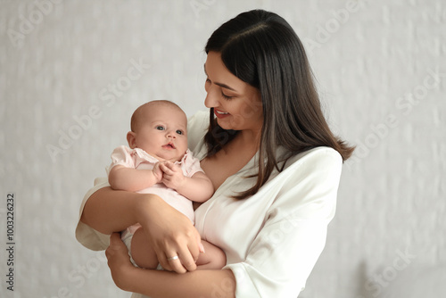 Young woman with her baby i...