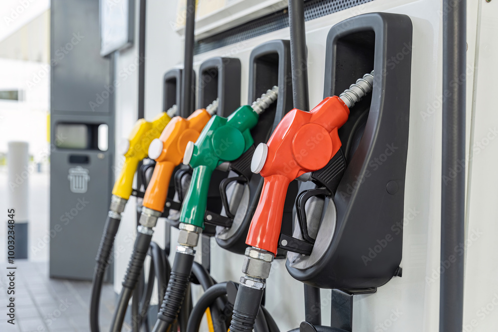 Fuel Pump, Gas Station, Gasoline.Colorful Petrol pump filling nozzles on white background , Gas station in a service in warm sunset.Head fuel vehicle refueling facility in Asia Fuel Pump, Gas Station, Gasoline.Colorful Petrol pump filling nozzles on white background , Gas station in a service in warm sunset.Head fuel vehicle refueling facility in Asia
