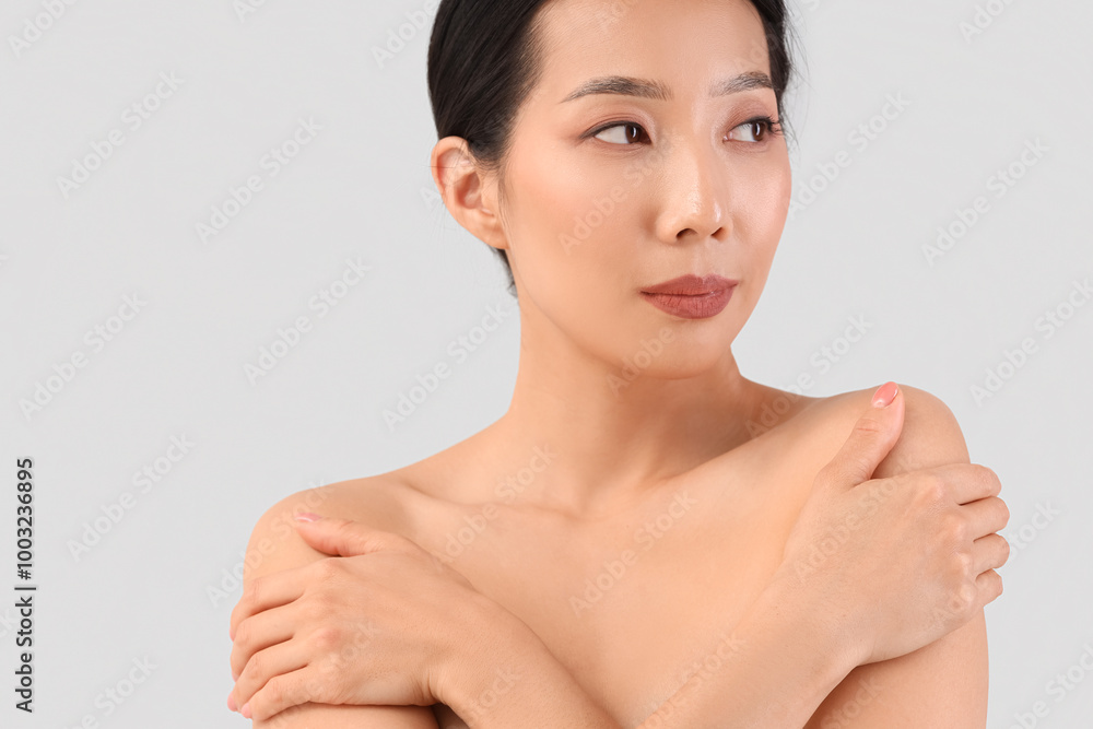 Beautiful Asian woman on light background, closeup Beautiful Asian woman on light background, closeup