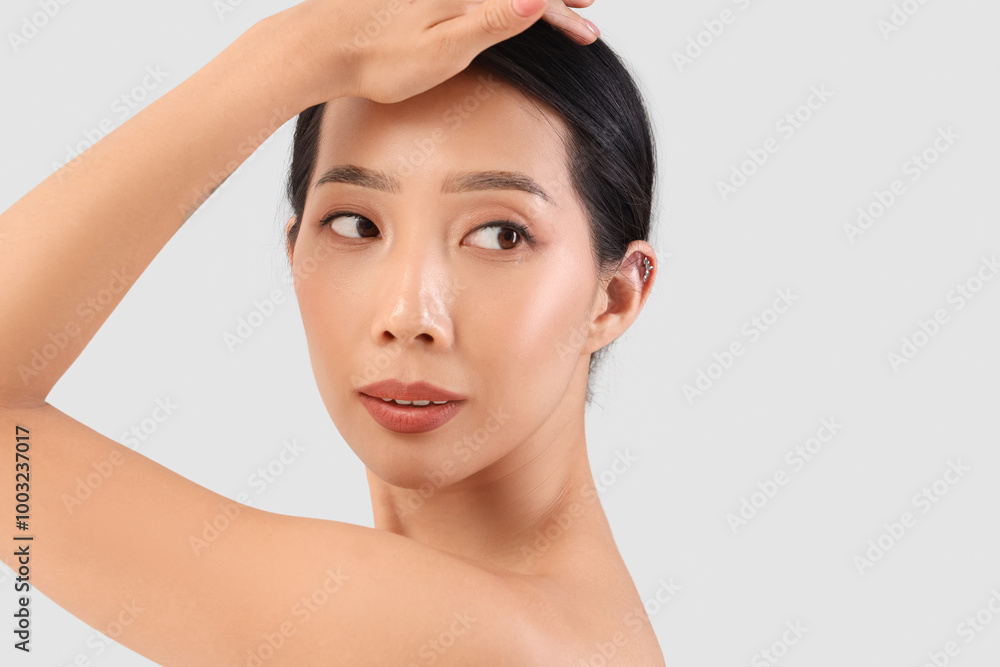 Beautiful Asian woman on light background, closeup Beautiful Asian woman on light background, closeup
