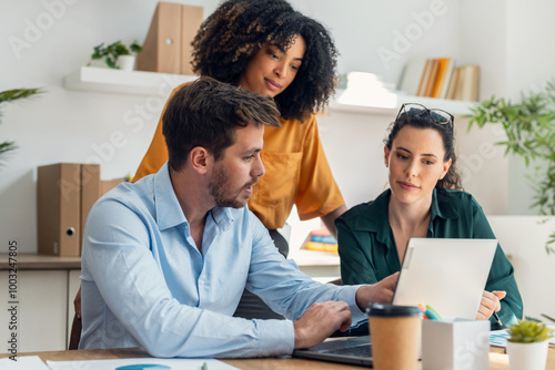 Business people working with laptop and talking of they new project together in the office.