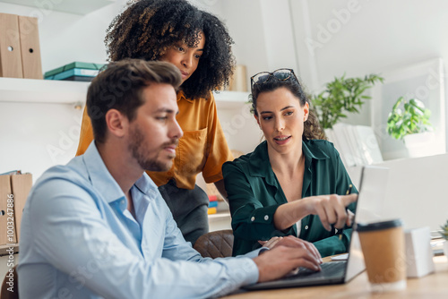 Business people working with laptop and talking of they new project together in the office.