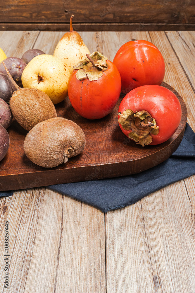 Wooden table full of fresh colorful fruits. Healthy eating and lifestyle. Healthy eating background with different fruits Wooden table full of fresh colorful fruits. Healthy eating and lifestyle. Healthy eating background with different fruits