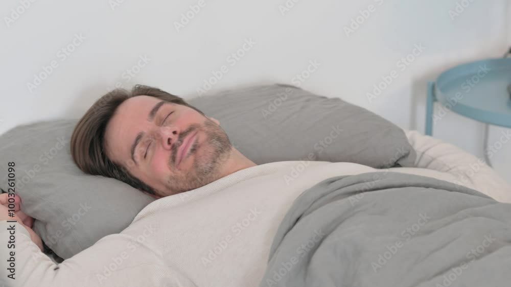 Tired Young Man Lying Down in Bed to Take Rest Tired Young Man Lying Down in Bed to Take Rest