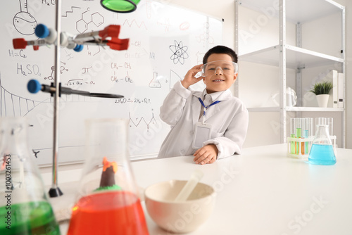 Cute little boy with scient...