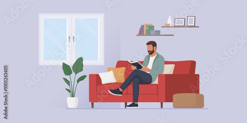 Man relaxing on the couch and reading a book photo