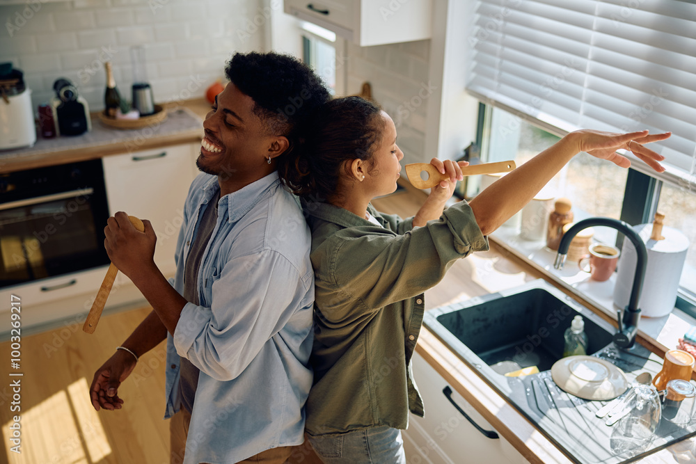 custom made wallpaper toronto digitalYoung carefree couple having fun while doing dishes in kitchen.