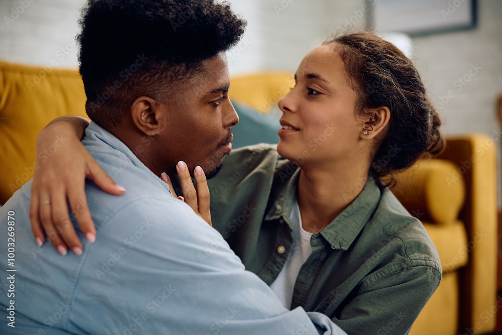 Young affectionate multiracial couple at home. Young affectionate multiracial couple at home.