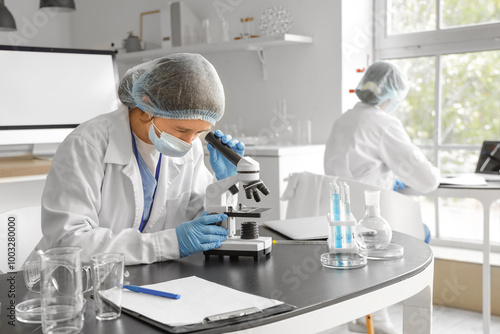 Female scientist looking th...