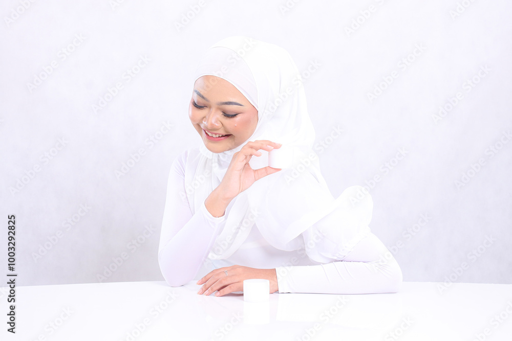 Gesture Beautiful adult veil woman laughing down hand holding cosmetic cream to shoulder for daily skin care routine needs on white background. Facial treatment, Perfect skin Gesture Beautiful adult veil woman laughing down hand holding cosmetic cream to shoulder for daily skin care routine needs on white background. Facial treatment, Perfect skin