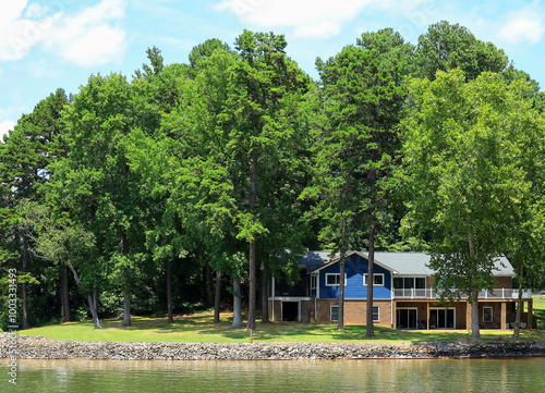 Beautiful lakefront home surrounded by tall trees in North Carolina, USA. 