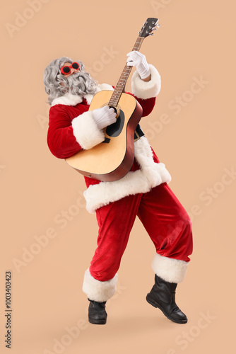 Cool Santa Claus playing gu...